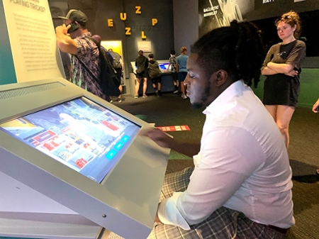 Middle Georgia State University School of Computing / Department of IT’s student Coby Roye, BSIT in software engineering, attempts to crack a cypher inside the Spy Museum where students learned about practices and cases involving governmental spying actions during the Cybersecurity Seminar.